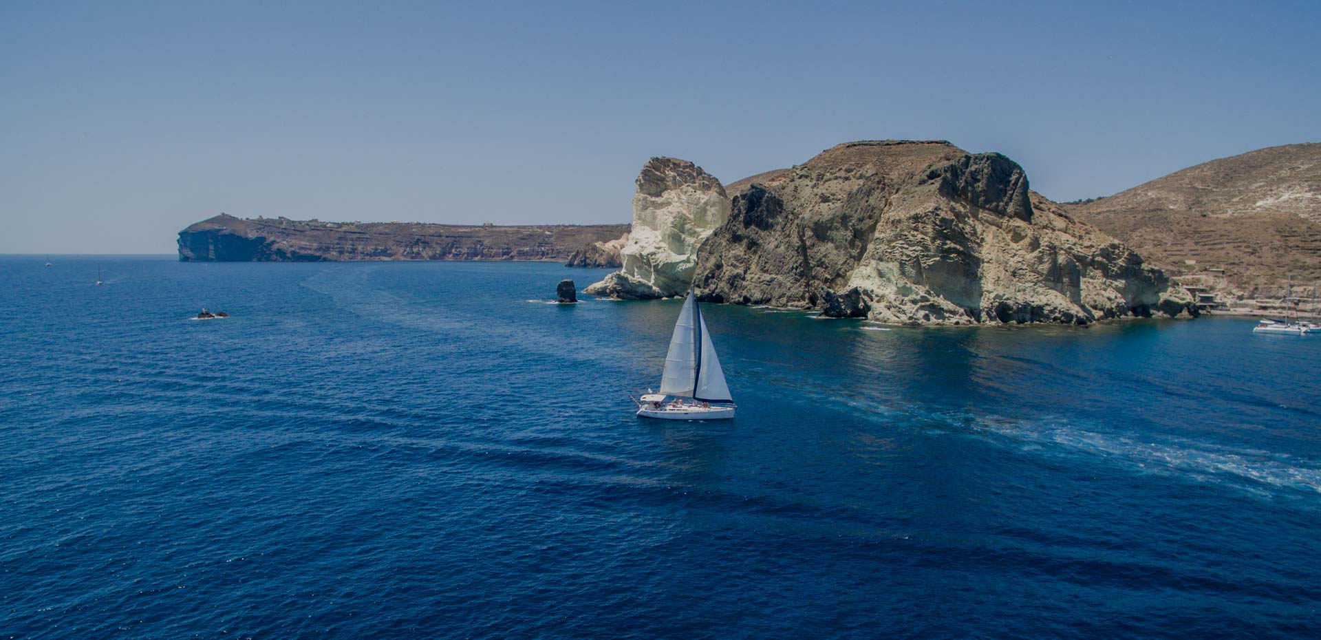 Barca's sailing boat on a private morning excursion at santorini